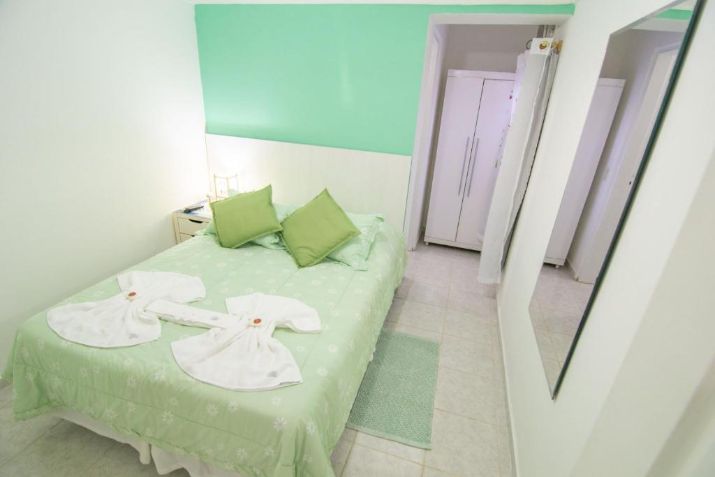 Cama ou camas em um quarto em Pousada Irashai