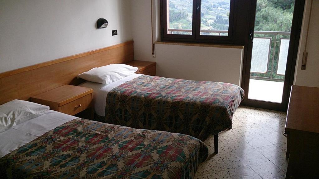 En eller flere senge i et værelse på MillePini