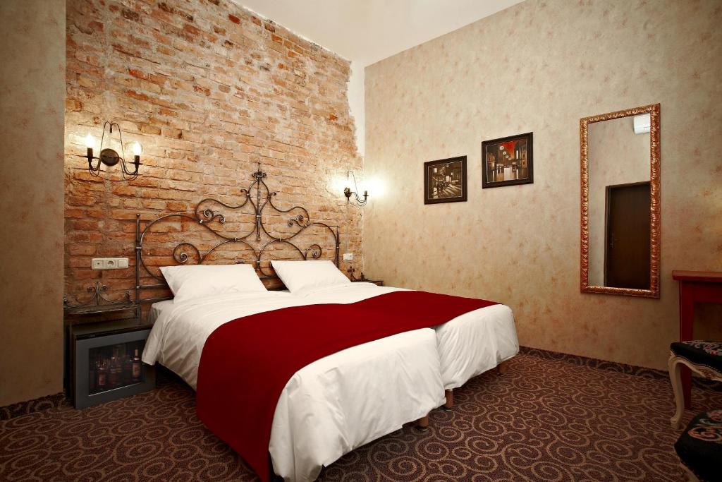 Postel nebo postele na pokoji v ubytování Boutique Hotel Justus