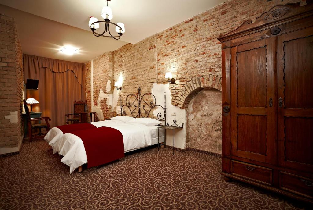 Postel nebo postele na pokoji v ubytování Boutique Hotel Justus