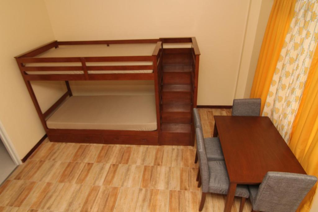 Postel nebo postele na pokoji v ubytování Charos Dormitel