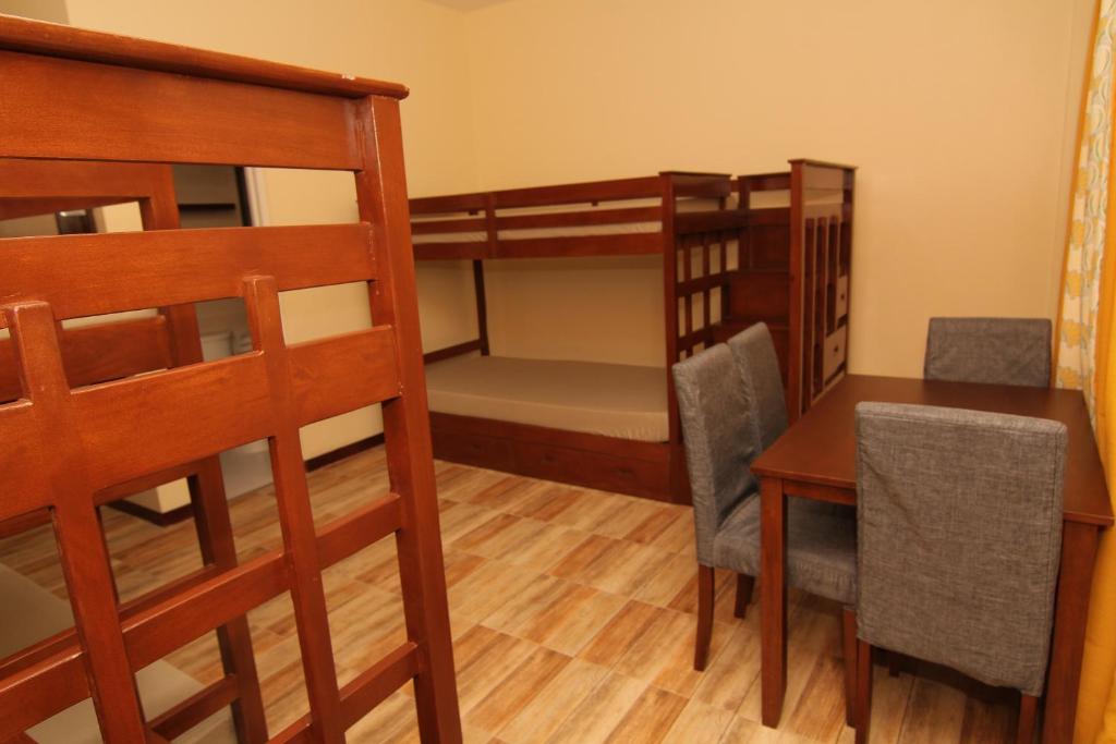 Postel nebo postele na pokoji v ubytování Charos Dormitel