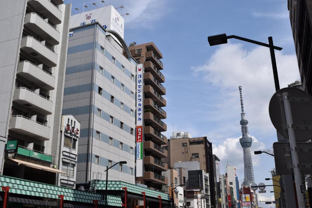 a city with a tall building and a tv tower at Asakusa Central Hotel in Tokyo