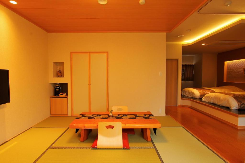 TV a/nebo společenská místnost v ubytování Hakone Hoshi no Akari