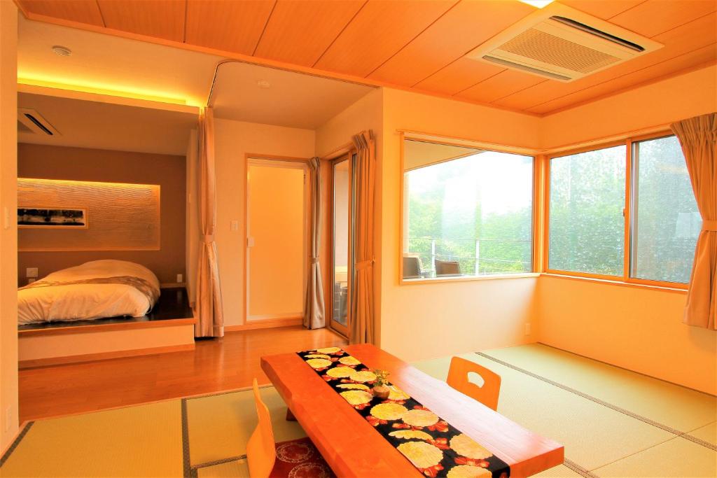 Postel nebo postele na pokoji v ubytování Hakone Hoshi no Akari