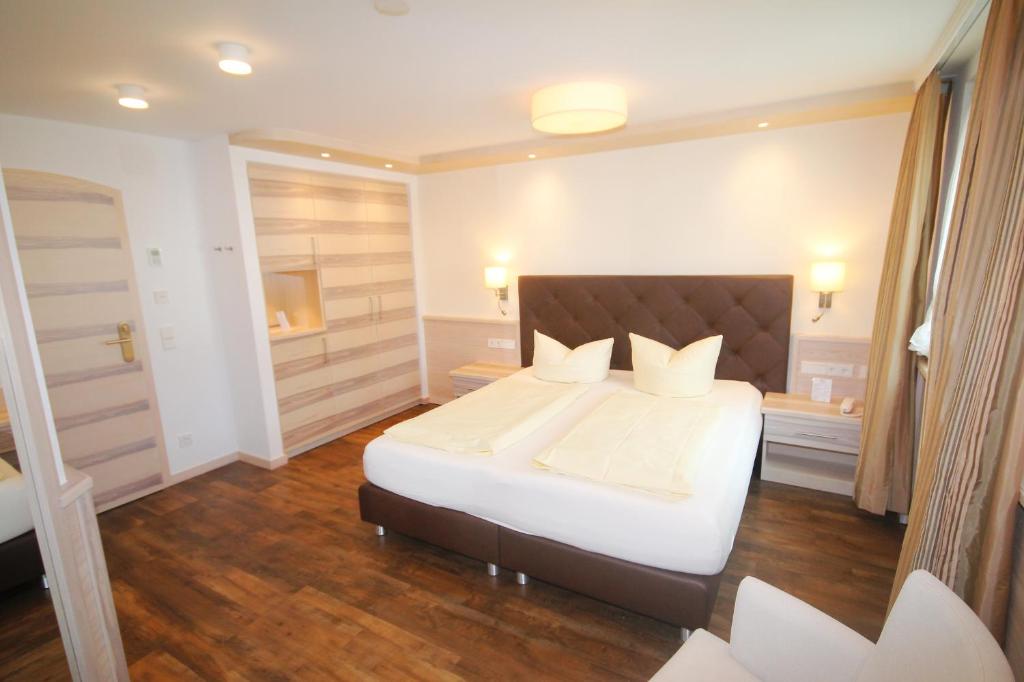 Postel nebo postele na pokoji v ubytování Wohlfühlhotel Bercher