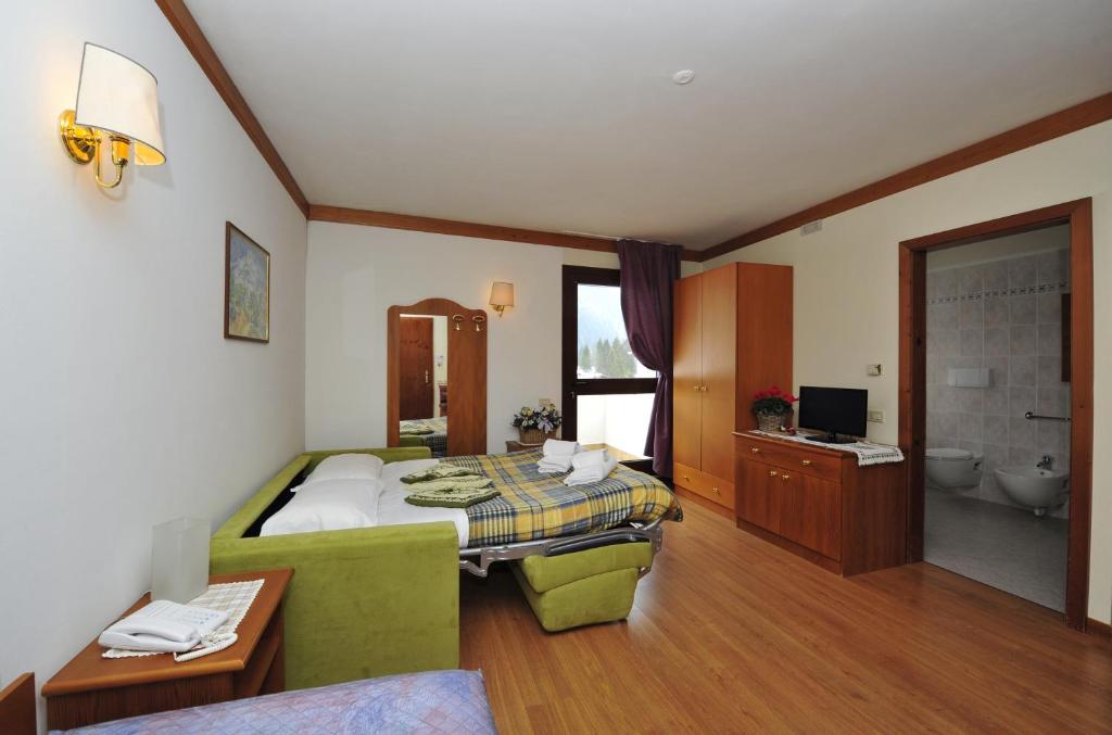 Televízia a/alebo spoločenská miestnosť v ubytovaní Ski Residence