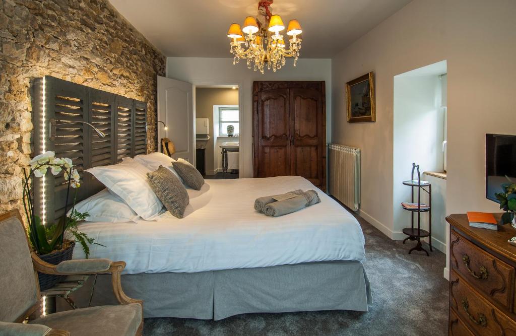 Postel nebo postele na pokoji v ubytování Château de Labro - Teritoria