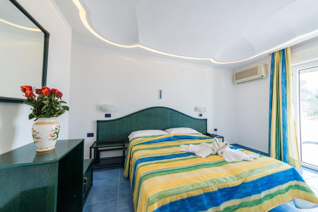 Letto o letti in una camera di Parco Residence La Rosa