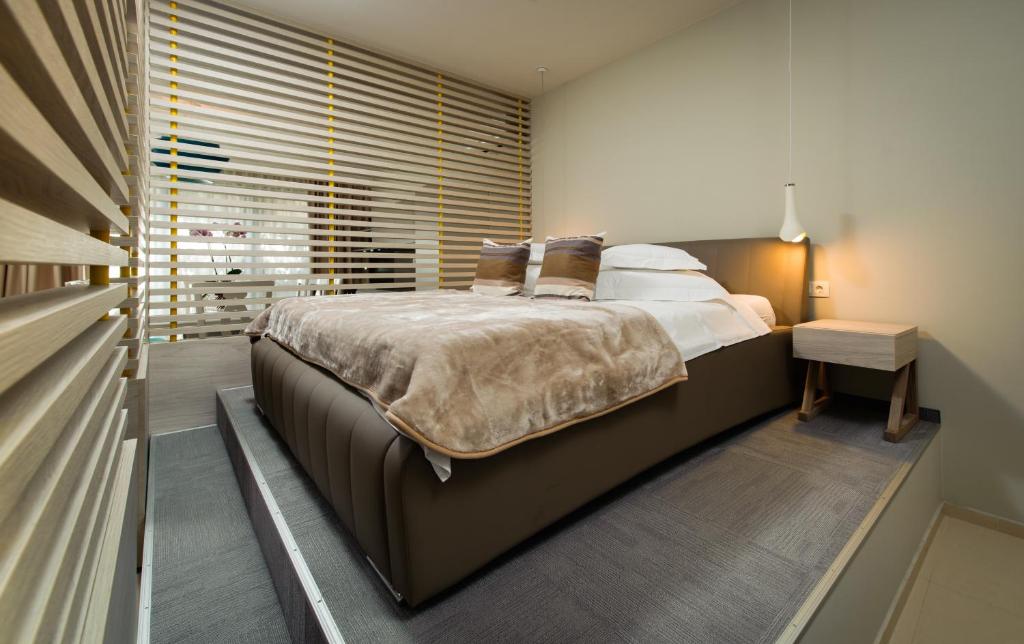 Posteľ alebo postele v izbe v ubytovaní Boban Luxury Suites