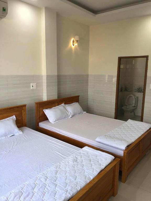 Postel nebo postele na pokoji v ubytování Nguyễn Kim Motel