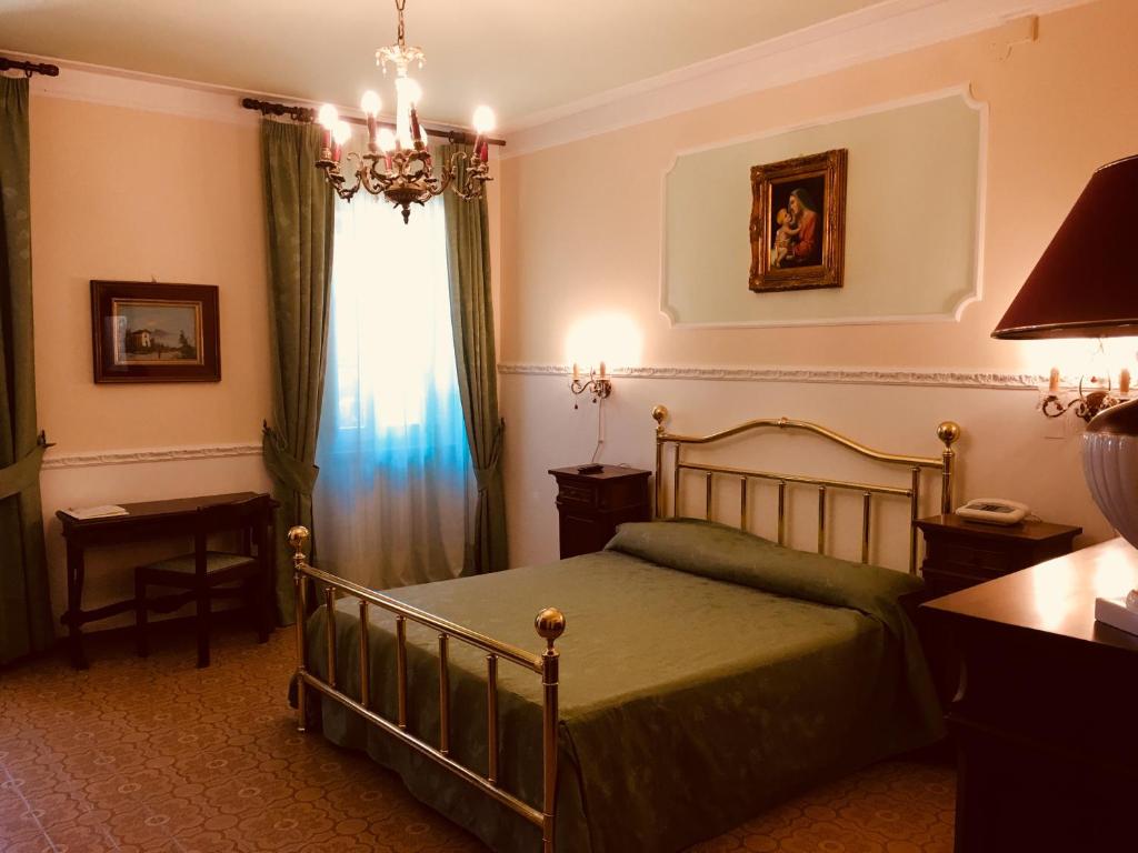 Postel nebo postele na pokoji v ubytování Hotel Villa San Donino