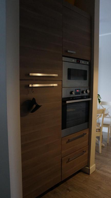 Kuchyň nebo kuchyňský kout v ubytování Apartamenty Legionów