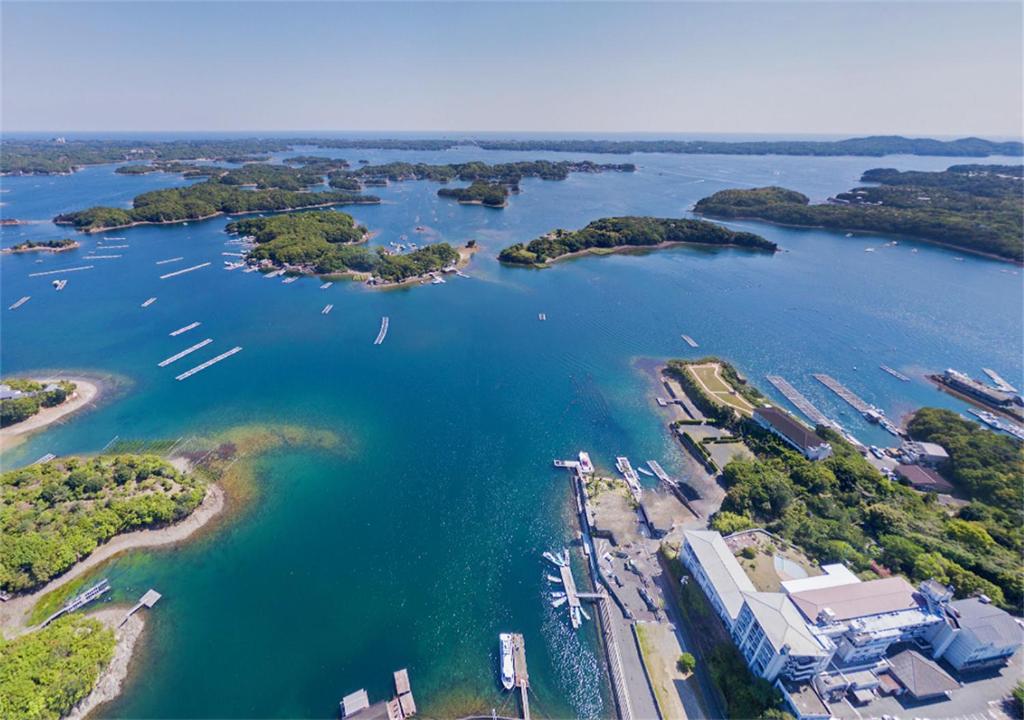 an aerial view of a harbor with boats in the water at Kashikojima Park Hotel Michishio in Shima