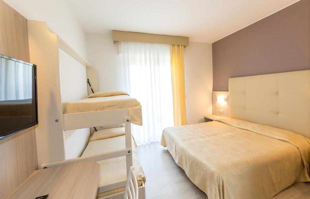 Postel nebo postele na pokoji v ubytování Hotel Torino
