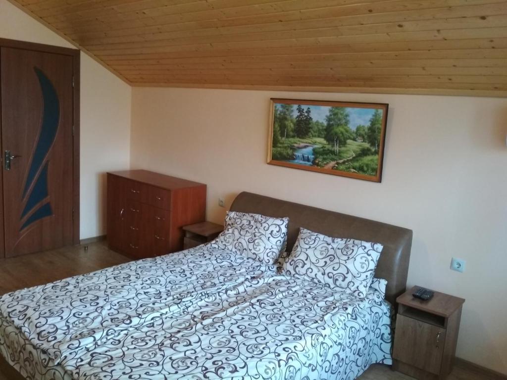 Postel nebo postele na pokoji v ubytování Котедж Silvia