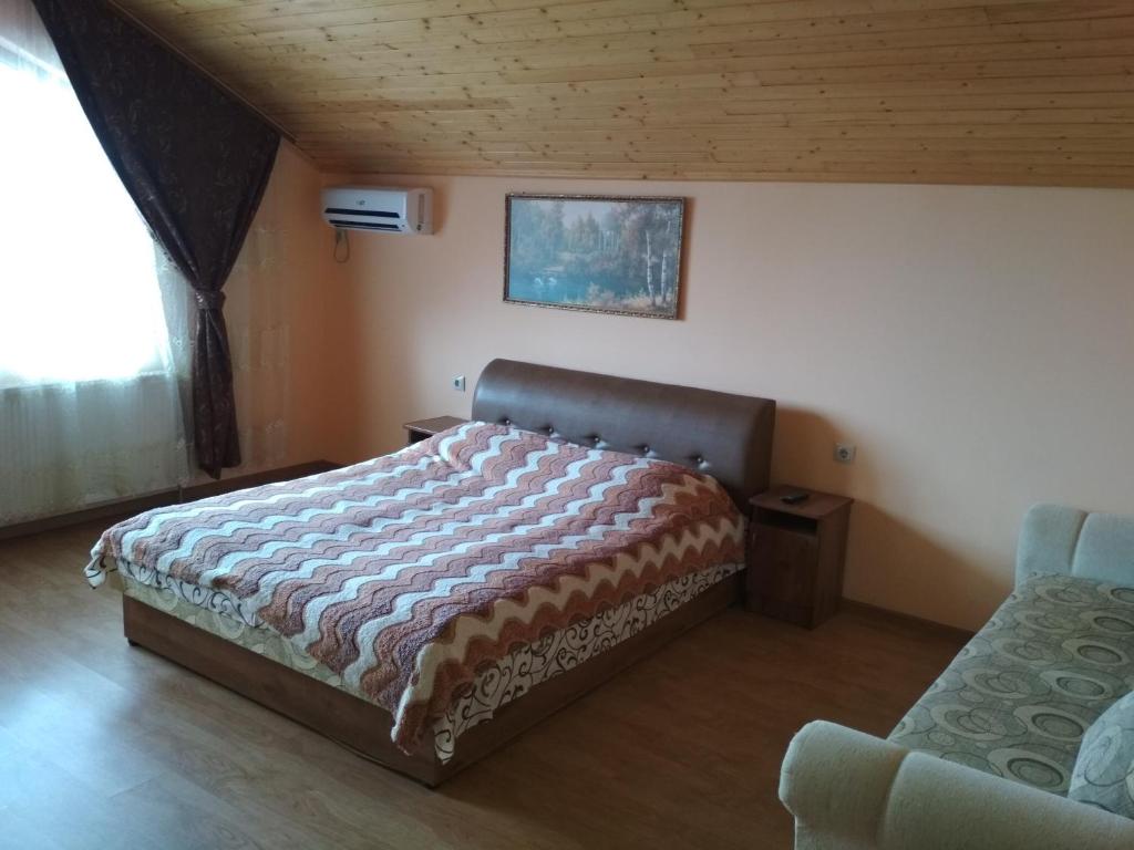 Postel nebo postele na pokoji v ubytování Котедж Silvia