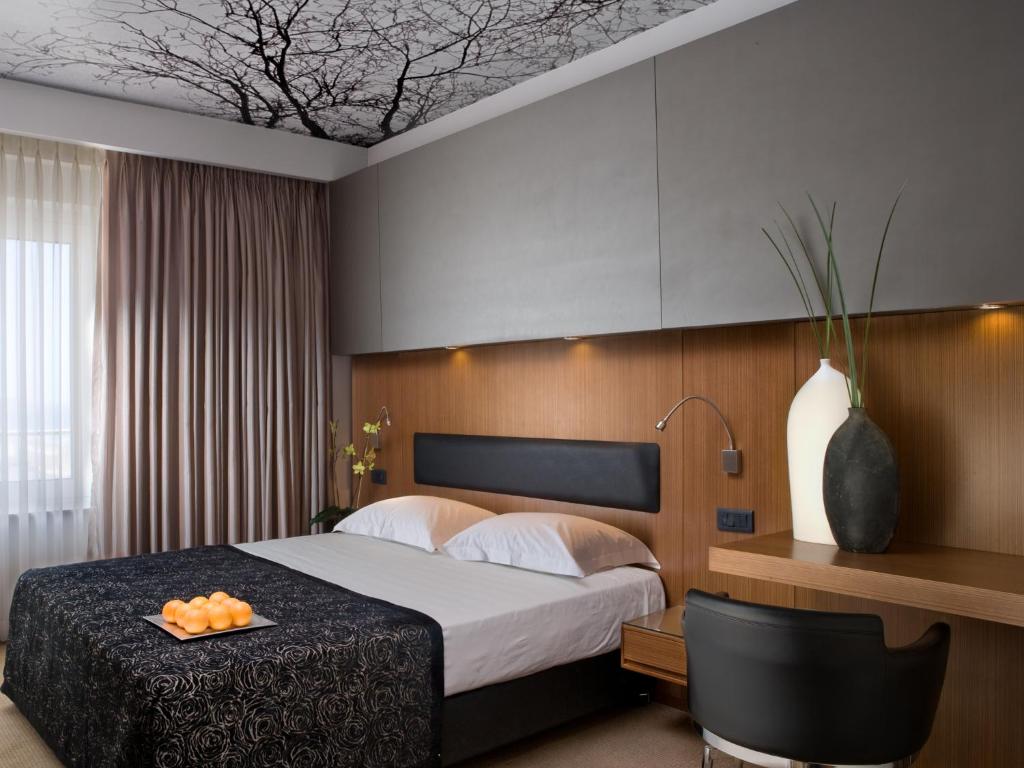Postel nebo postele na pokoji v ubytování Dan Tel Aviv Hotel
