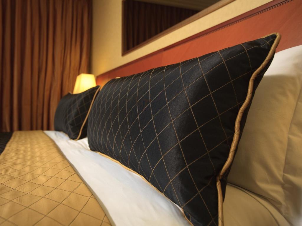 Postel nebo postele na pokoji v ubytování Dan Tel Aviv Hotel