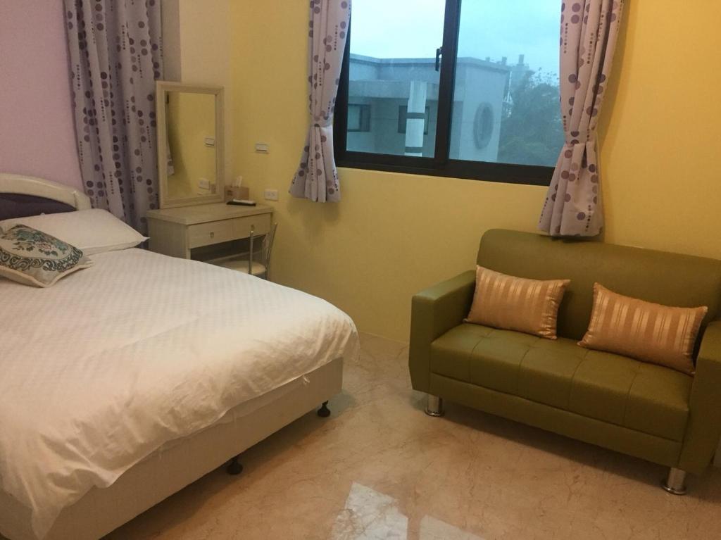 Postel nebo postele na pokoji v ubytování Miss Chang's B&B