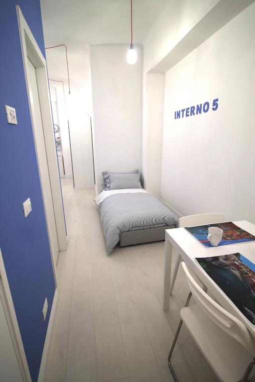 Postel nebo postele na pokoji v ubytování Interno5 Apartment