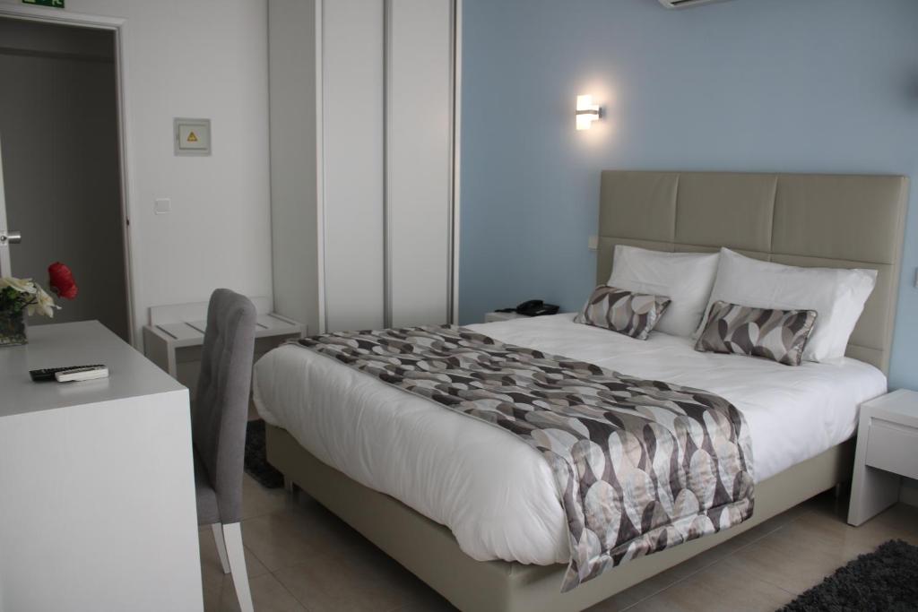 Cama ou camas em um quarto em Hotel Ancora Mar