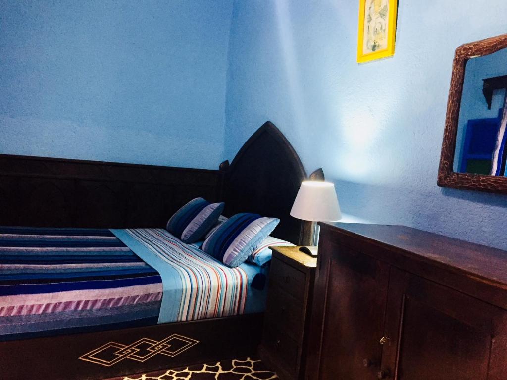 Llit o llits en una habitació de Dar Antonio