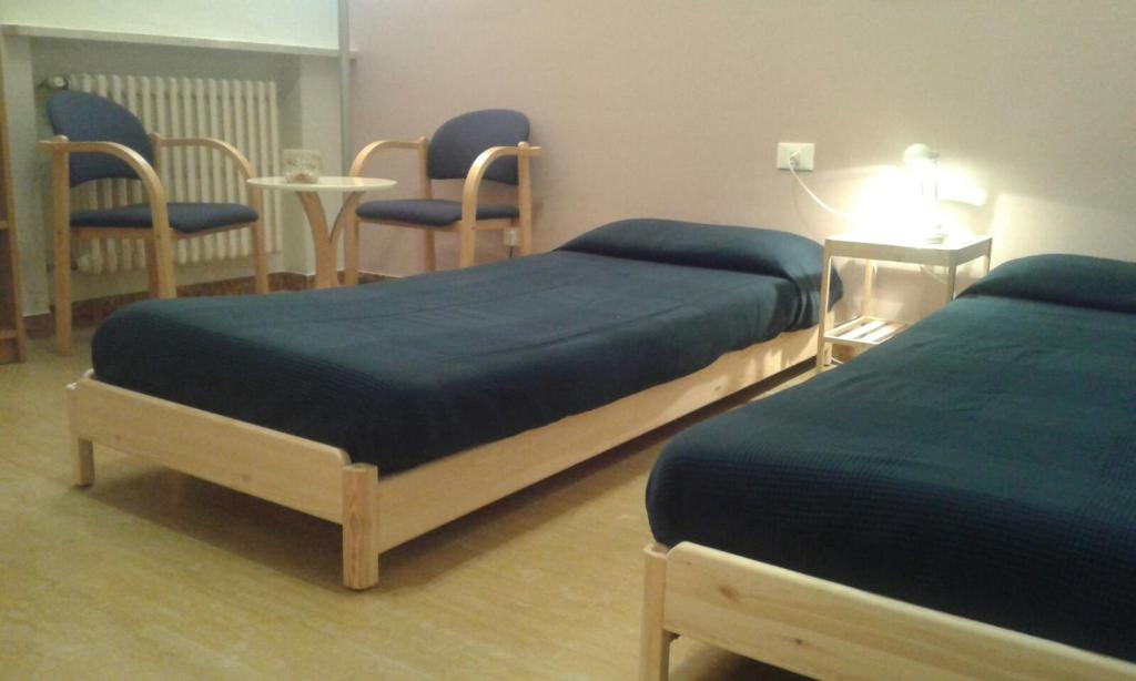 A bed or beds in a room at Fiore delle Valli