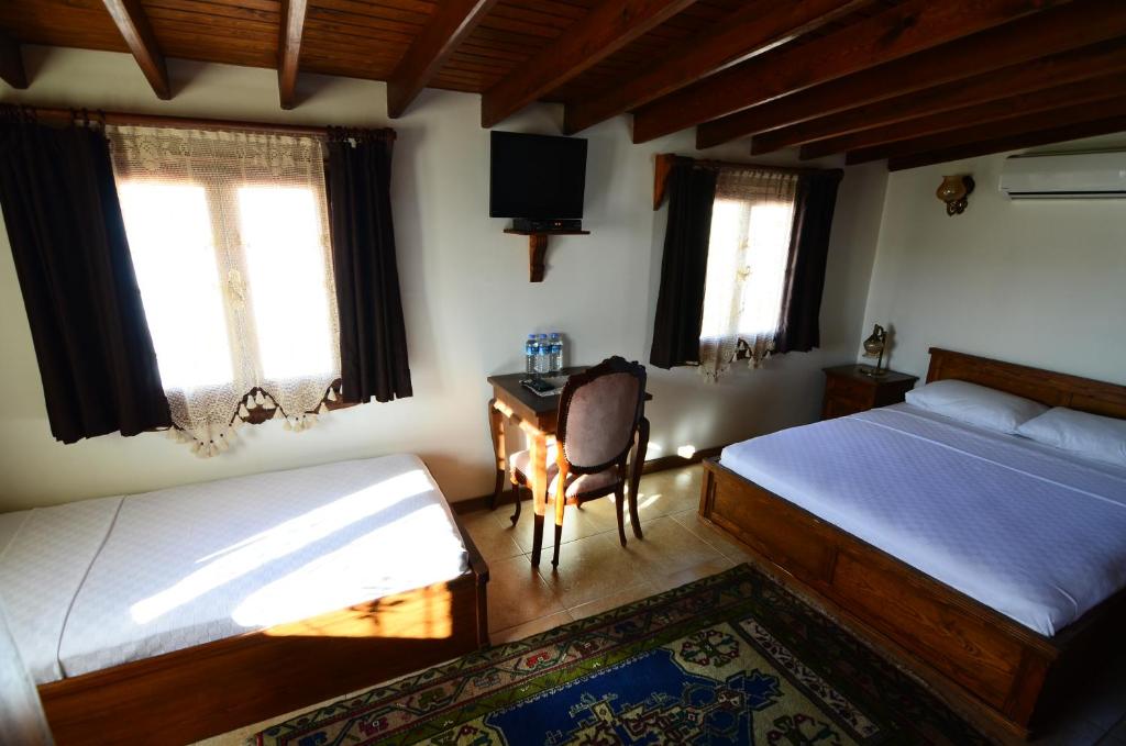 Postel nebo postele na pokoji v ubytování Ayışığı Hotel