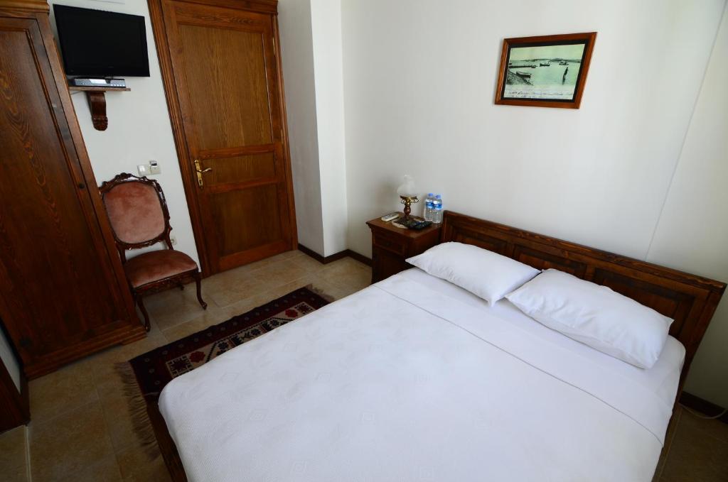 Postel nebo postele na pokoji v ubytování Ayışığı Hotel