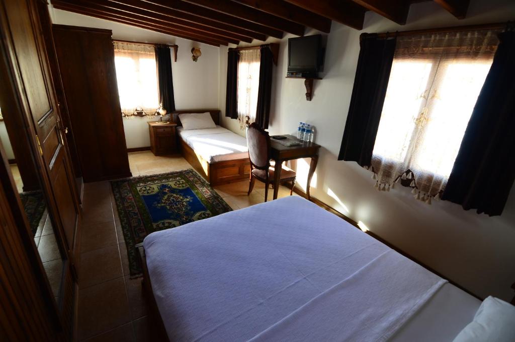 Postel nebo postele na pokoji v ubytování Ayışığı Hotel