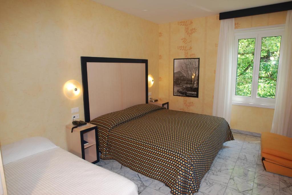 Postel nebo postele na pokoji v ubytování Hotel&Hostel Montarina