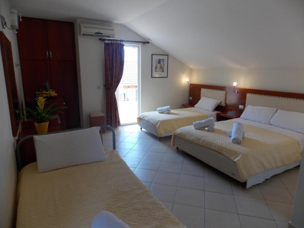 Postel nebo postele na pokoji v ubytování Hotel Veli