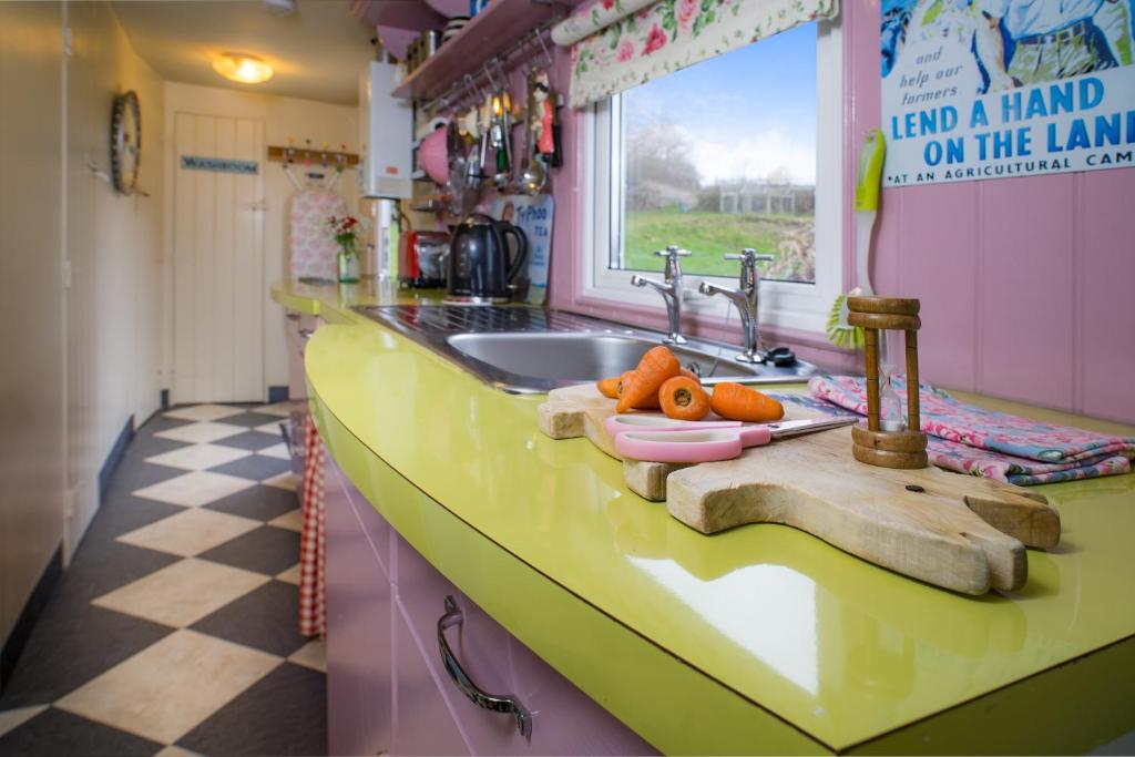 a kitchen counter with a sink and a window at The Glamavan in Llandysul