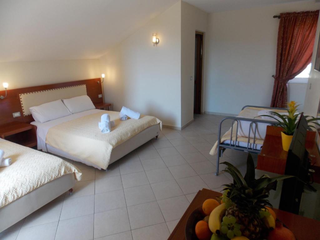 Postel nebo postele na pokoji v ubytování Hotel Veli