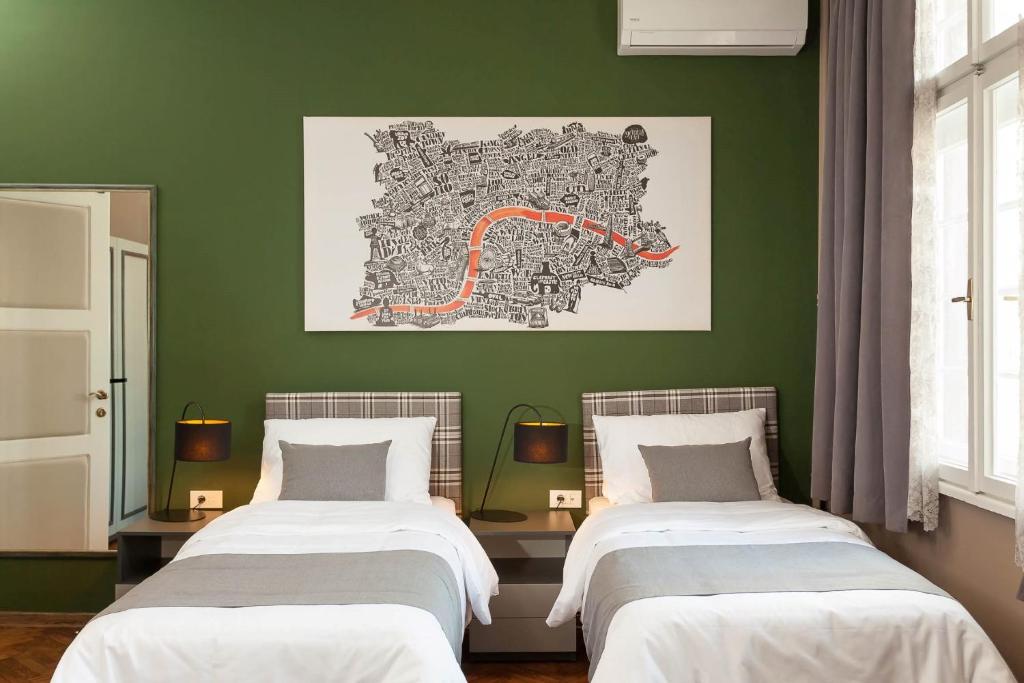 Postel nebo postele na pokoji v ubytování Hotel London B&B