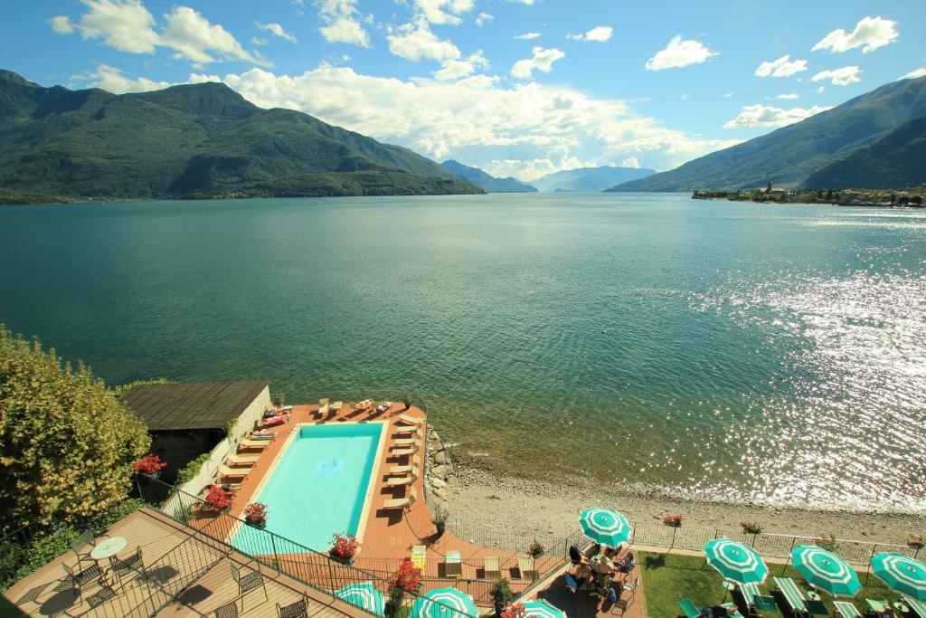 a view of a body of water with a swimming pool at Hotel Regina in Gravedona