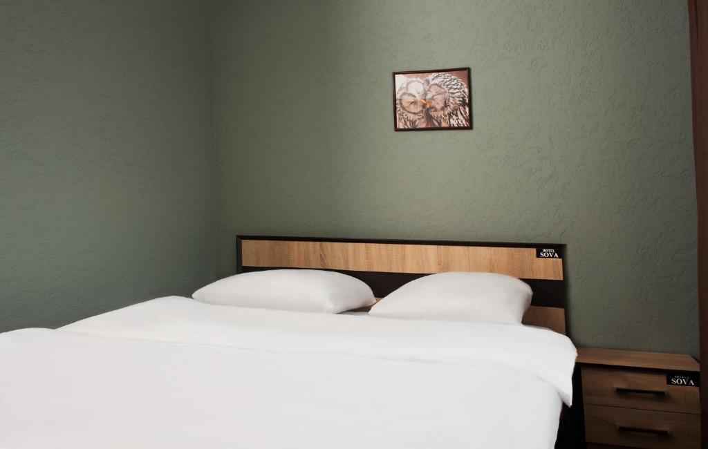 Postel nebo postele na pokoji v ubytování Sova