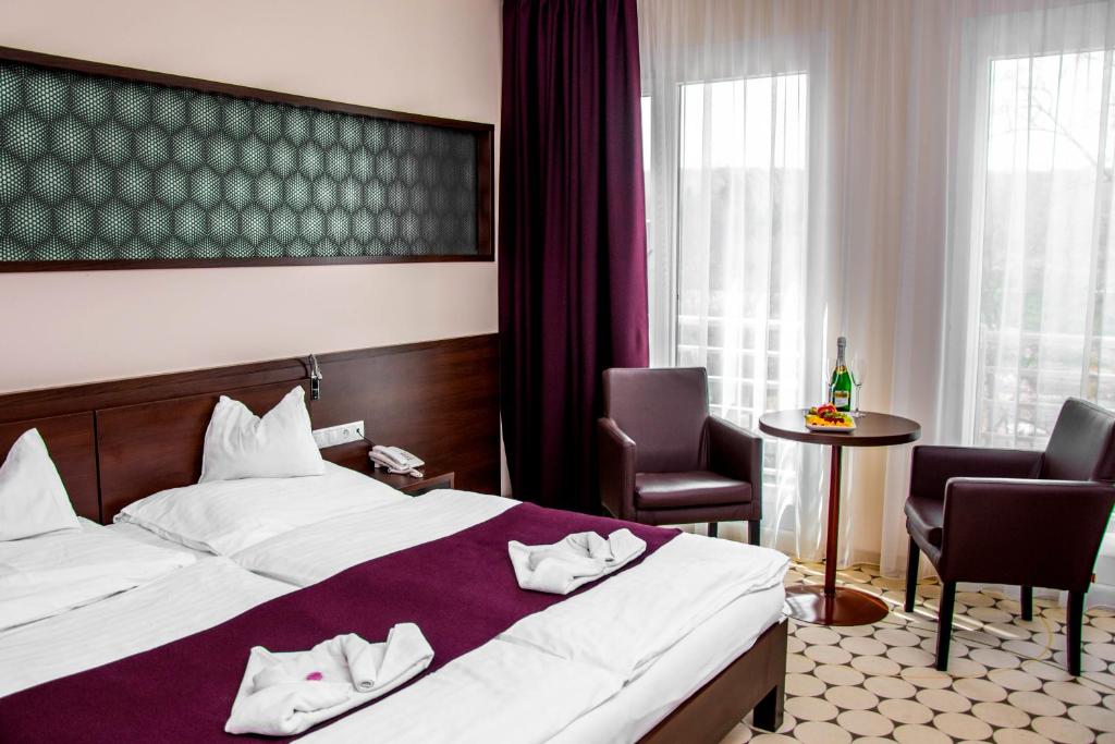 Postel nebo postele na pokoji v ubytování Hotel Aurora