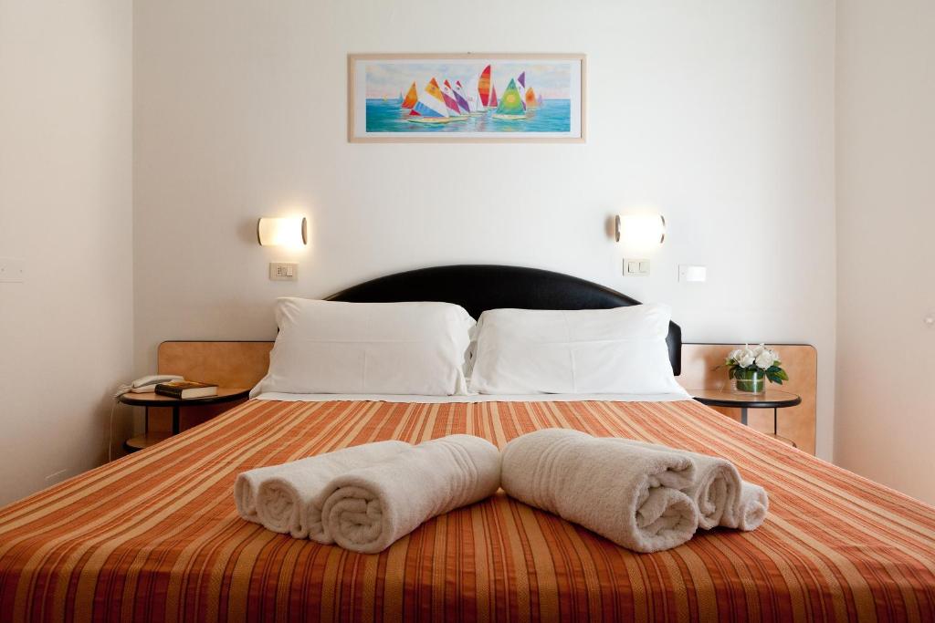 Postel nebo postele na pokoji v ubytování Hotel Rivazzurra