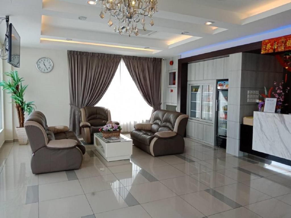 Posezení v ubytování Oscar Suites Hotel