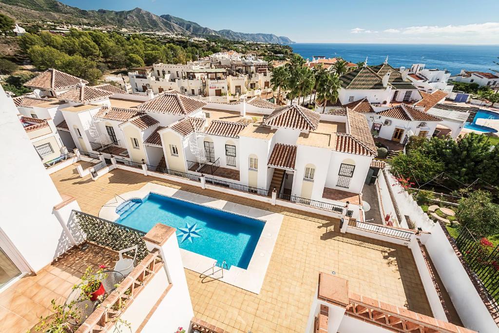 an aerial view of a villa with a swimming pool at Apartamentos Chimenea in Nerja