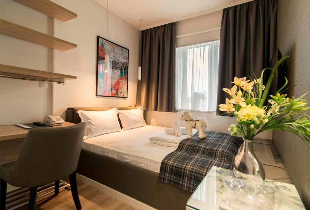 Krevet ili kreveti u jedinici u okviru objekta Belgrade Inn Garni Hotel