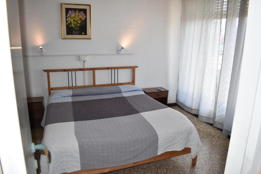 Un pat sau paturi într-o cameră la Appartamento Paola