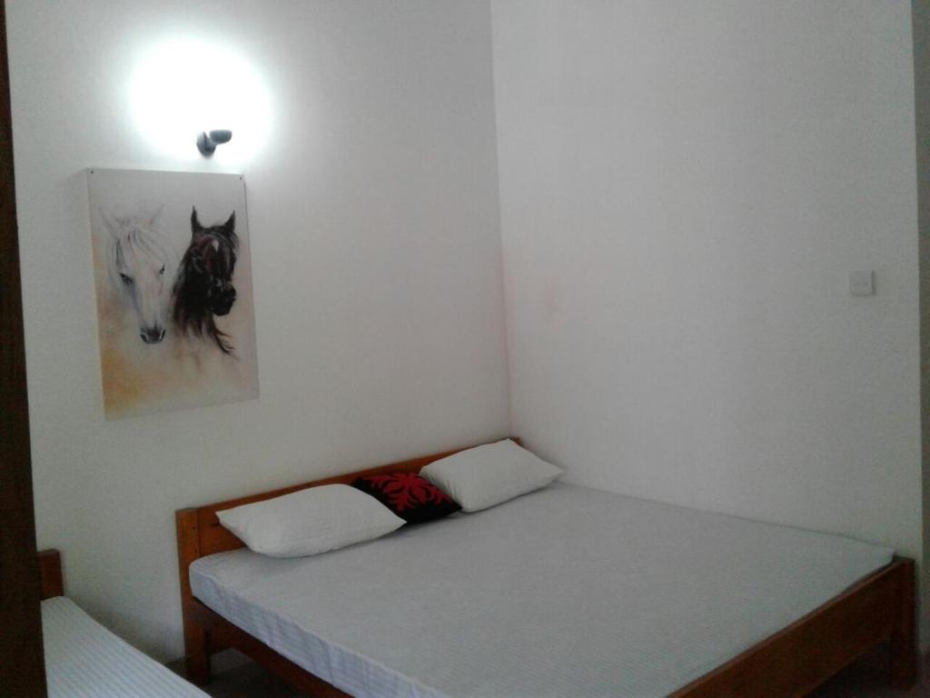 Postel nebo postele na pokoji v ubytování Amadi Rest