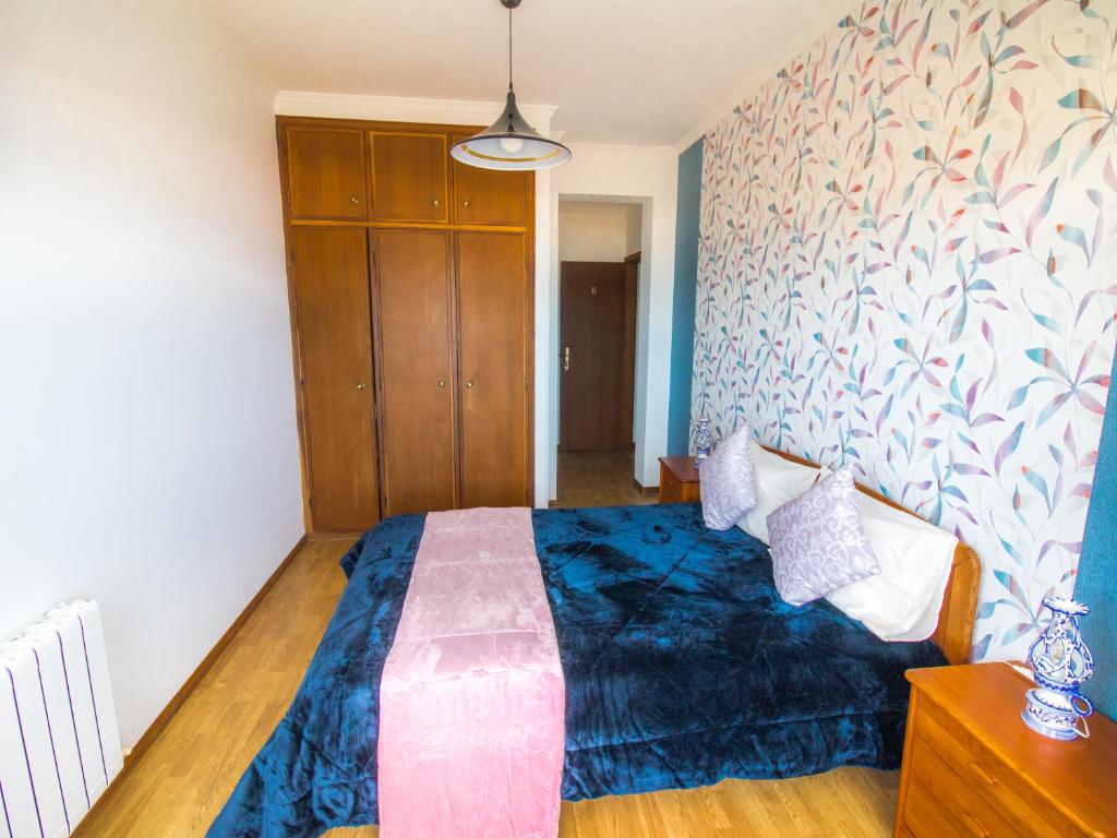 Postel nebo postele na pokoji v ubytování Quarto Crescente