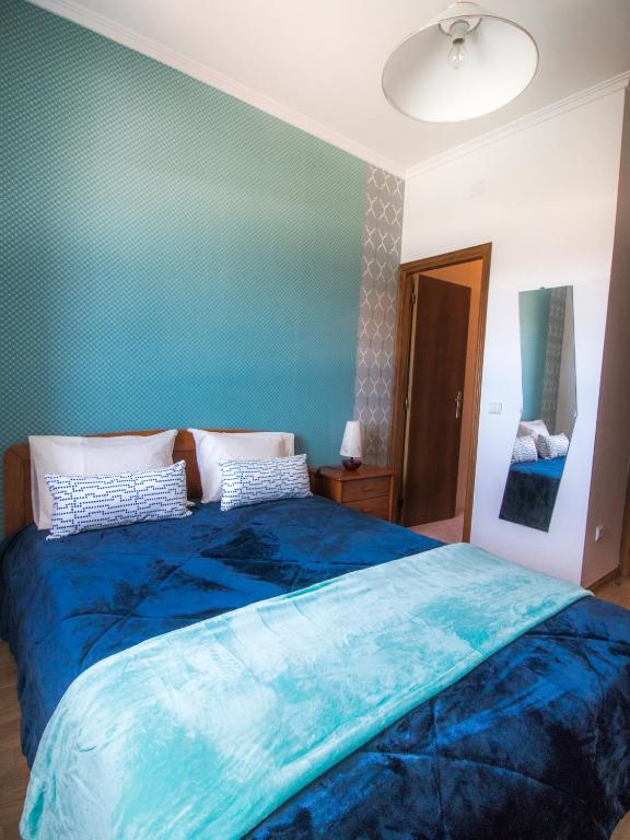 Postel nebo postele na pokoji v ubytování Quarto Crescente