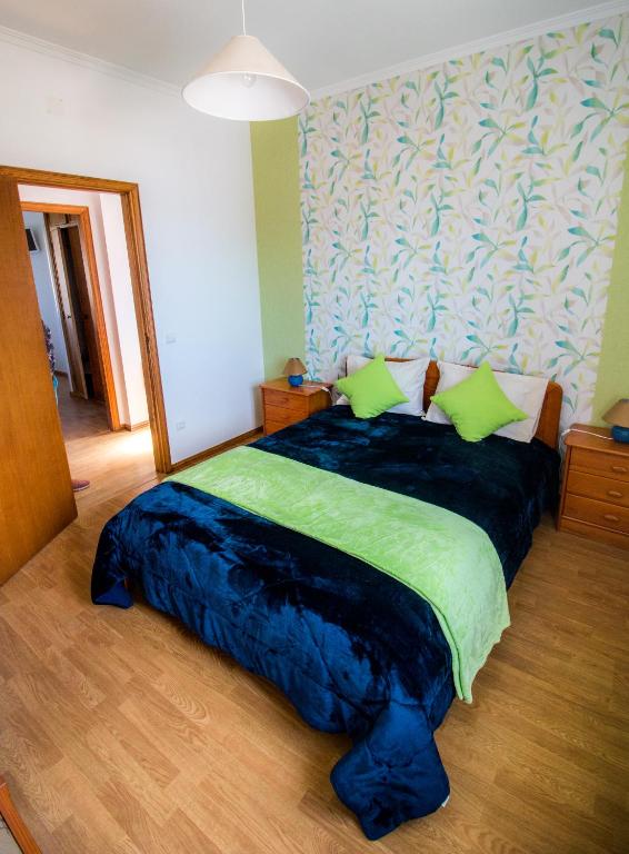 Postel nebo postele na pokoji v ubytování Quarto Crescente