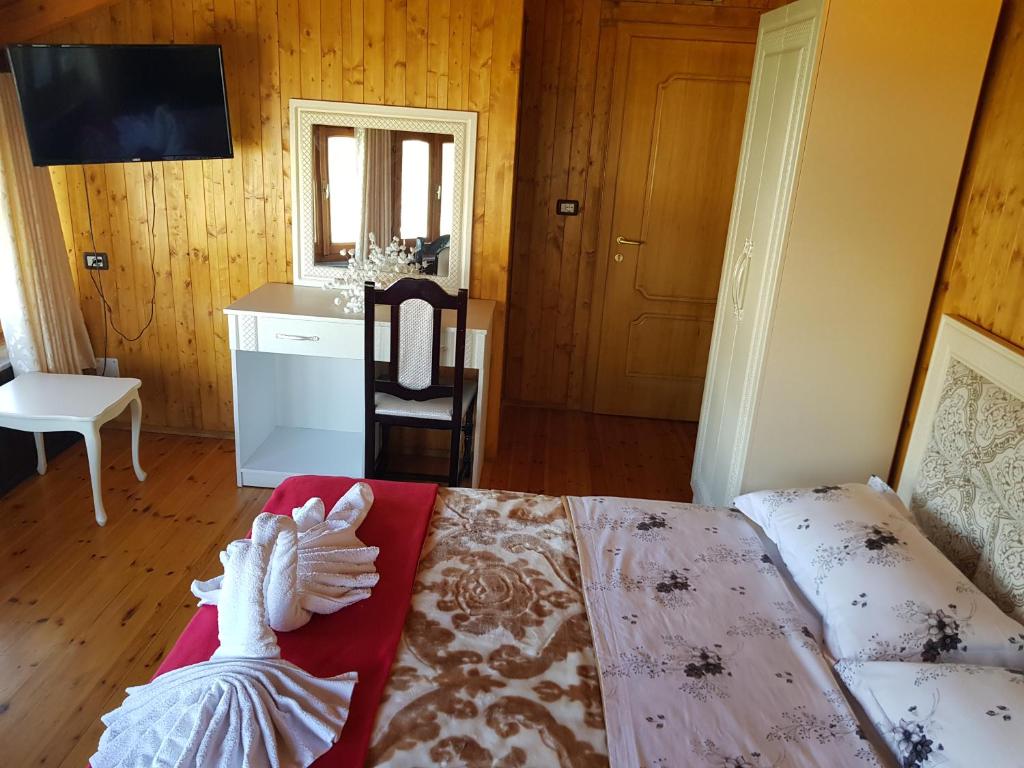 Postel nebo postele na pokoji v ubytování Hotel Vataksi