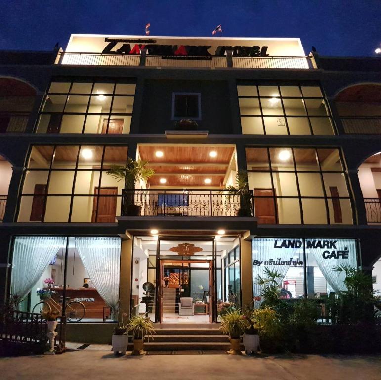 a large black building with a balcony and lights at Landmark Maha Sarakham in Maha Sarakham